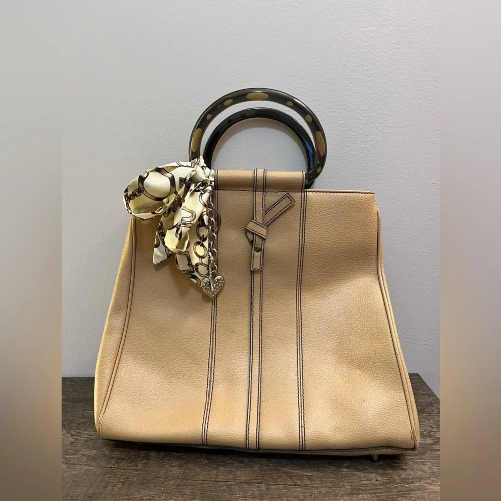Tan leather tote with acrylic handles by Christine deGennaro
